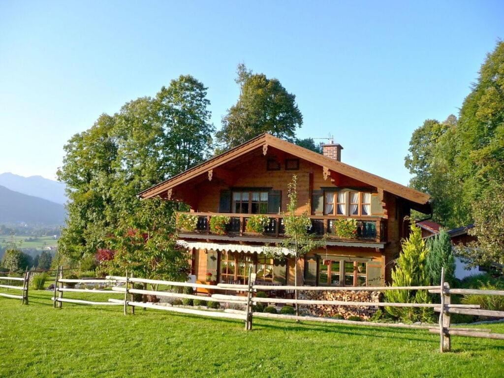 a house with a fence in front of it at Malerhäusl Modern retreat in Schönau am Königssee