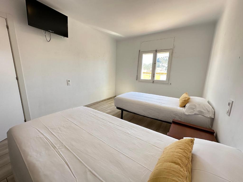 Postel nebo postele na pokoji v ubytování Agi Gloria Rooms