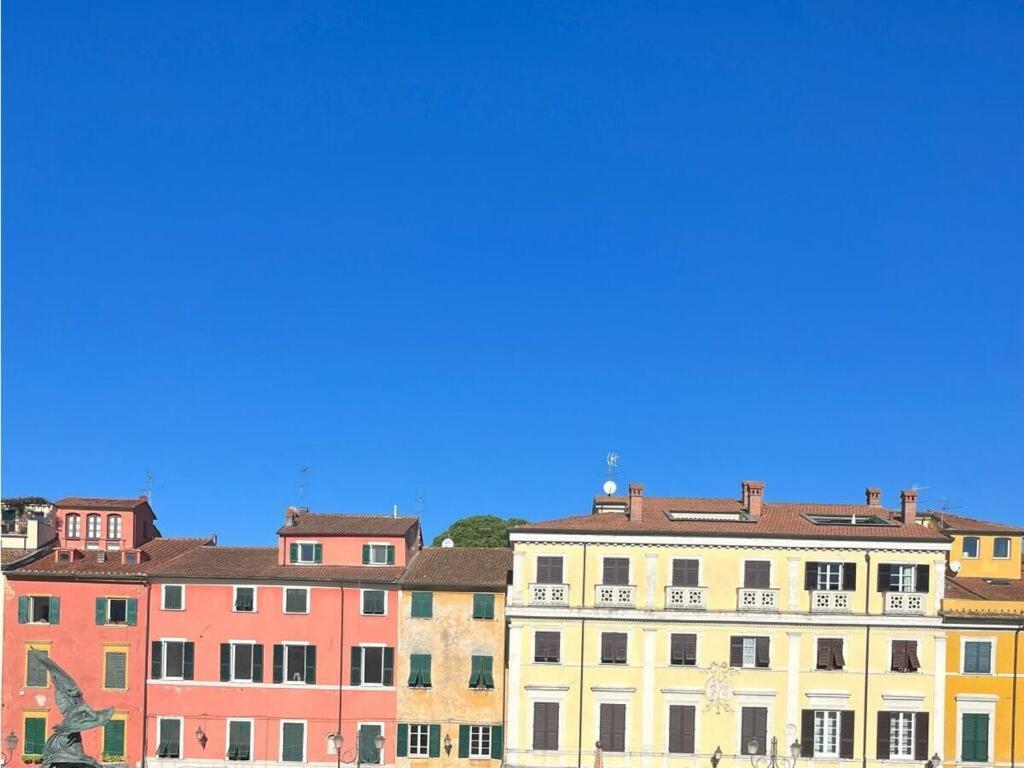a group of colorful buildings in a city at Royal Suite Sarzana in Sarzana