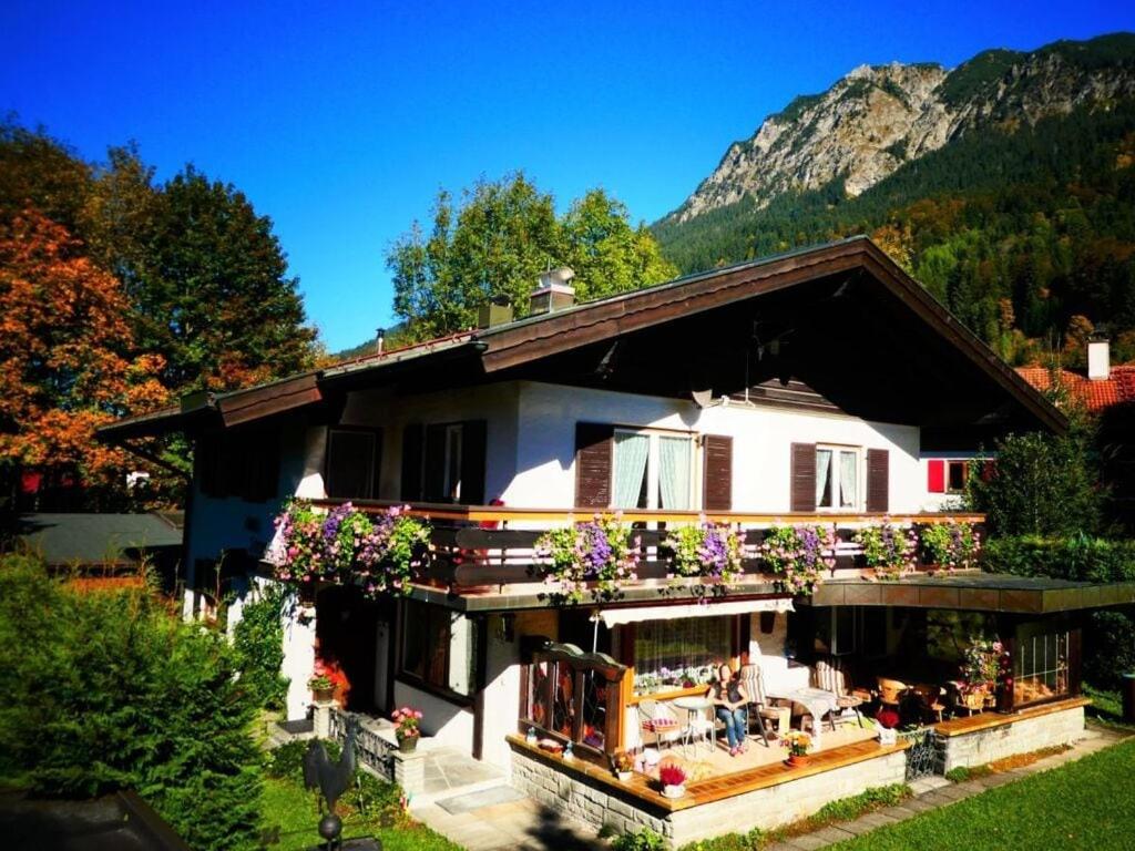 a house with flowers on the front of it at Haus Steiner Modern retreat in Oberstdorf
