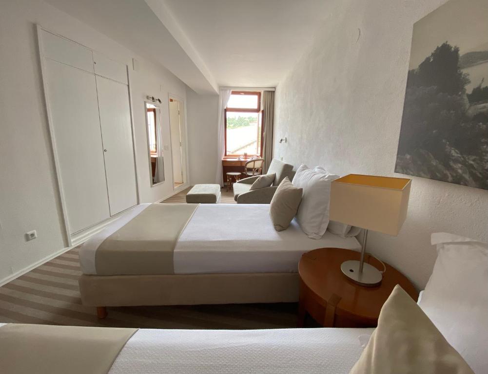 Postel nebo postele na pokoji v ubytování Hotel Glavovic