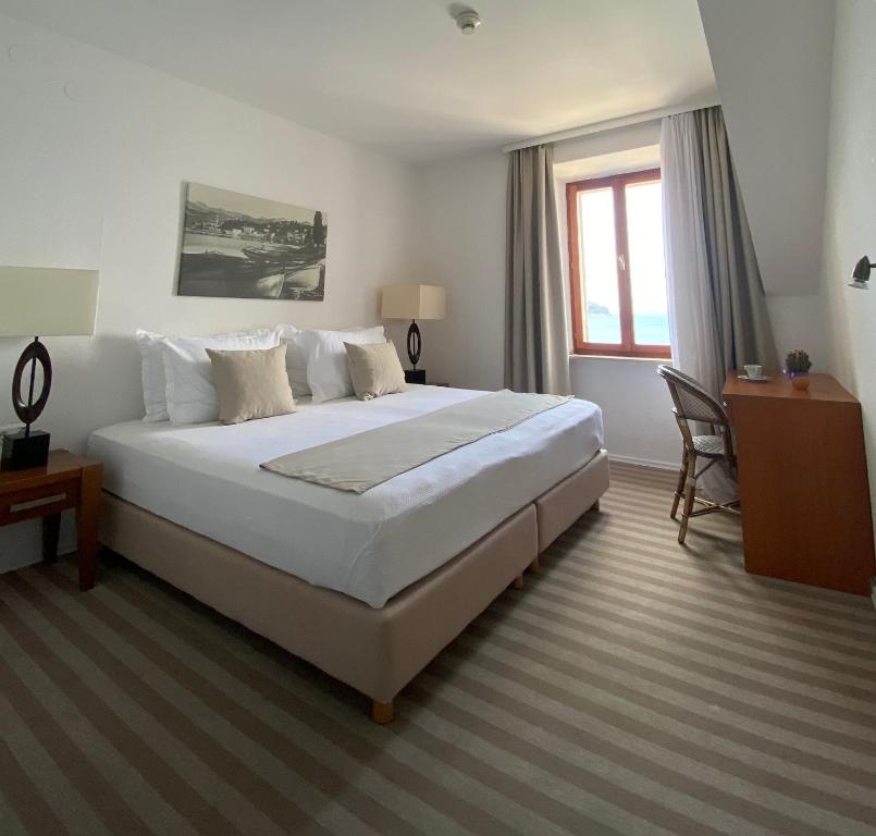 Postel nebo postele na pokoji v ubytování Hotel Glavovic