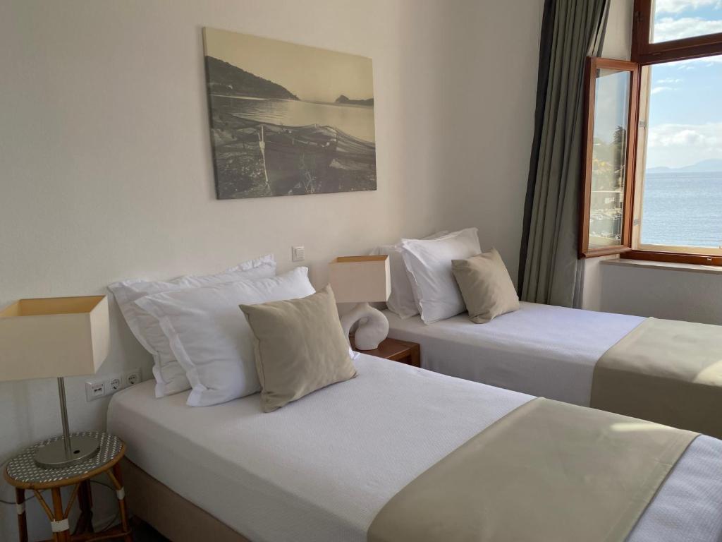 Postel nebo postele na pokoji v ubytování Hotel Glavovic
