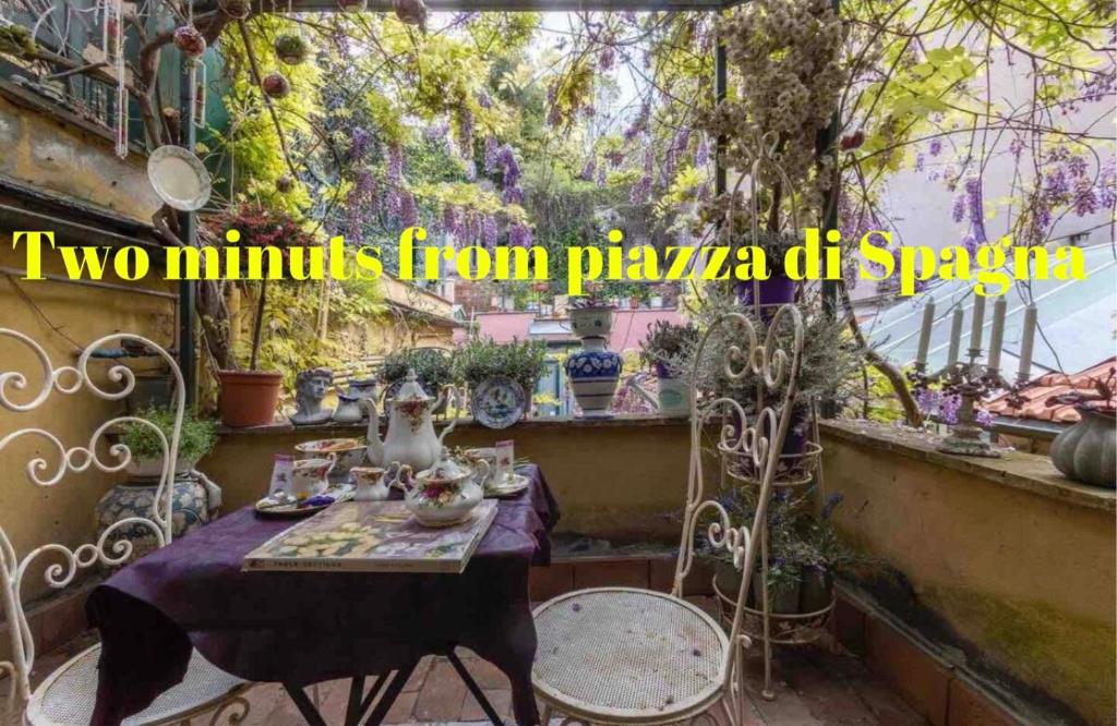 two miniatures from playa dhasy sitting on a table in a garden at Margutta 46 private spa in Rome