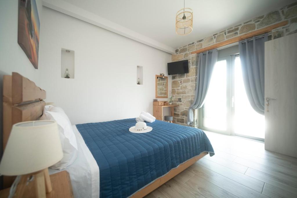 Postel nebo postele na pokoji v ubytování Elixrysos Apartment 1