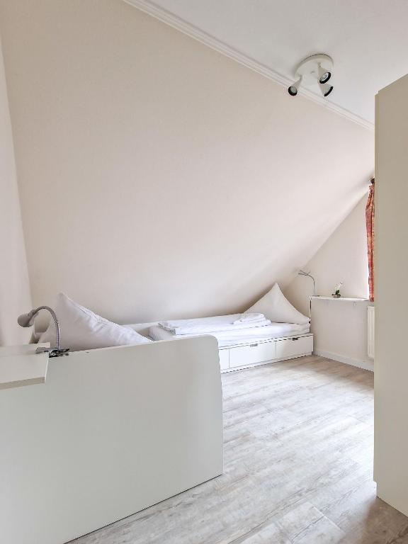 Postel nebo postele na pokoji v ubytování Dörte