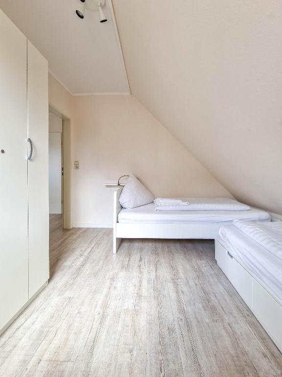 Postel nebo postele na pokoji v ubytování Dörte