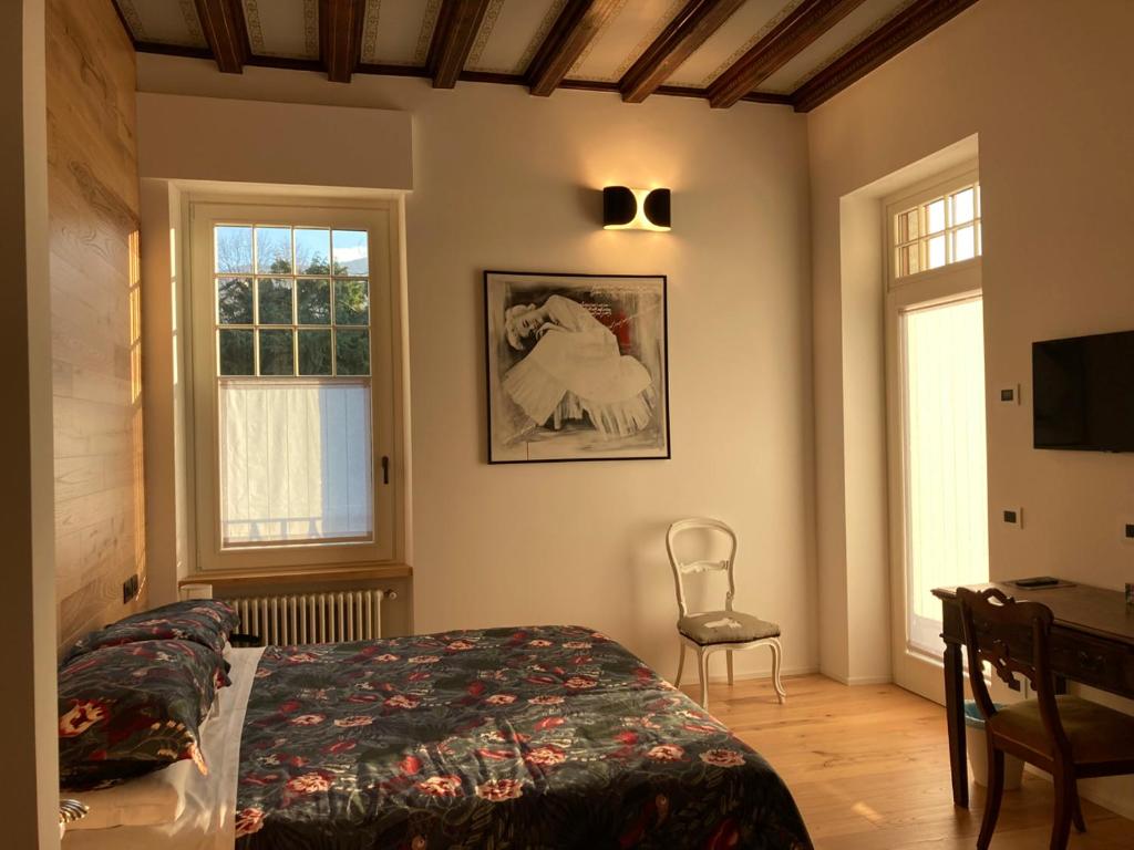 Postel nebo postele na pokoji v ubytování B&B Villa Cortese