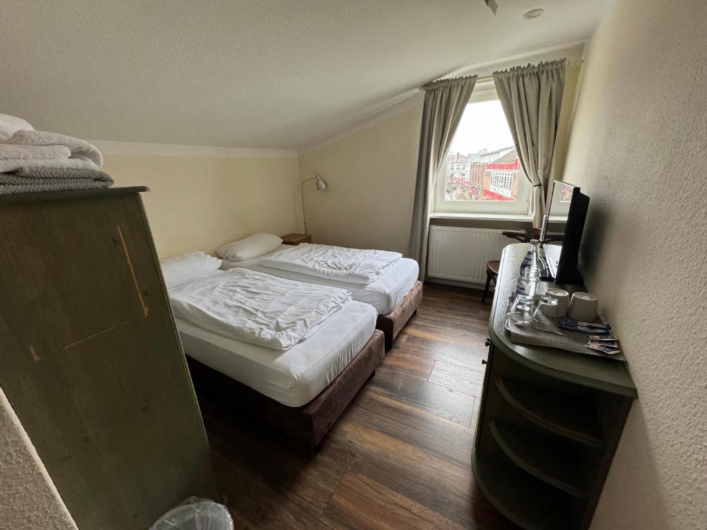 Letto o letti in una camera di Borgo Antico Hotel