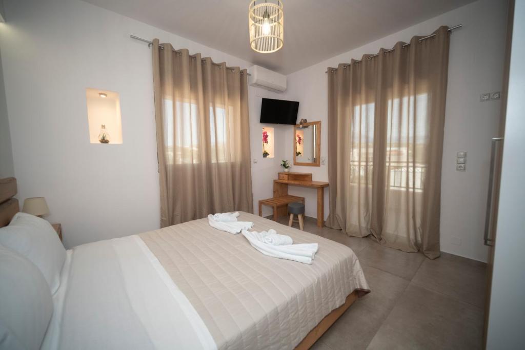 Postel nebo postele na pokoji v ubytování Elixrysos Apartment 2