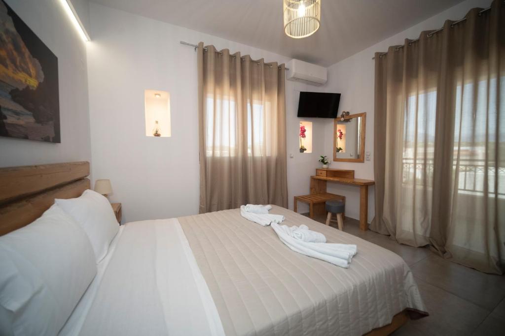 Postel nebo postele na pokoji v ubytování Elixrysos Apartment 2
