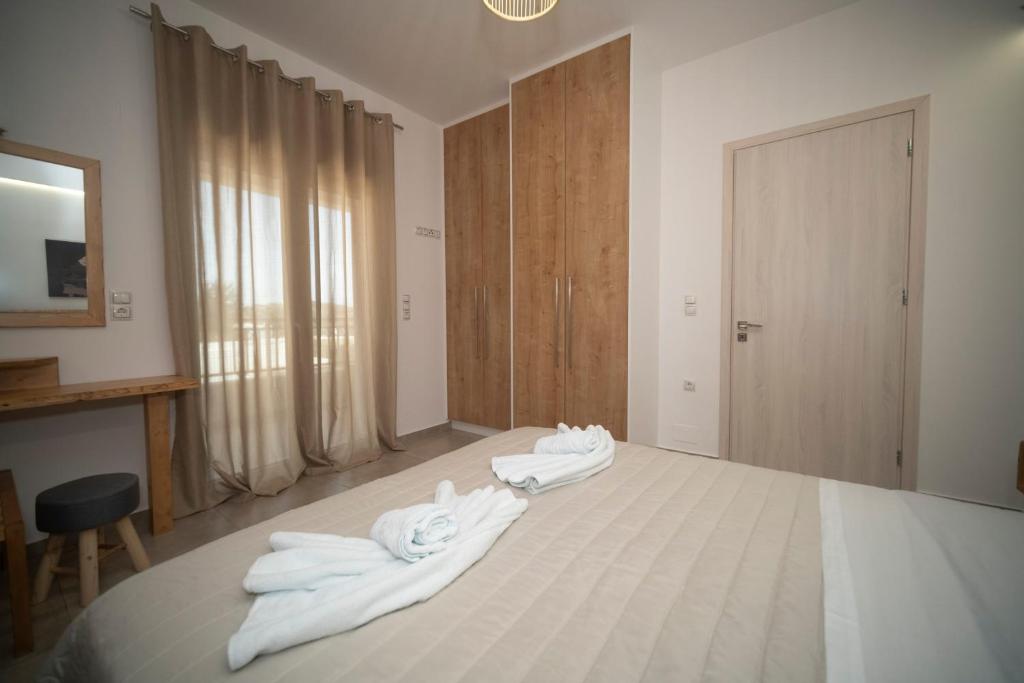 Postel nebo postele na pokoji v ubytování Elixrysos Apartment 2