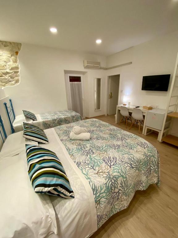 Postel nebo postele na pokoji v ubytování Zimmer Camere