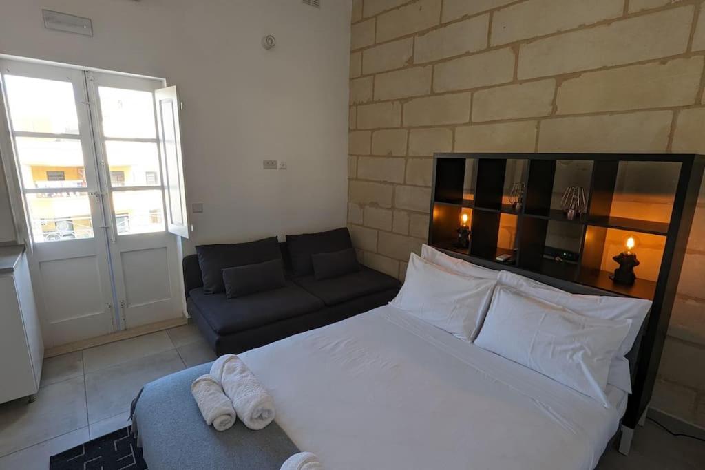 Postel nebo postele na pokoji v ubytování Casa Cospicua