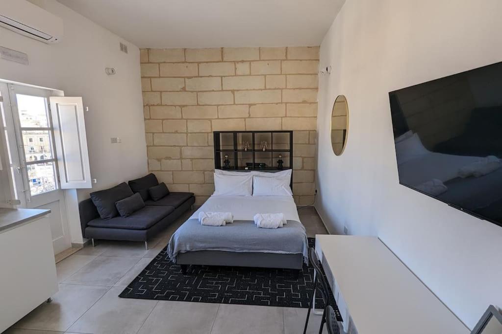 Postel nebo postele na pokoji v ubytování Casa Cospicua