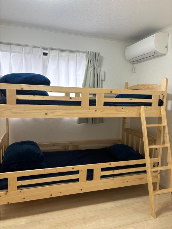 Postel nebo postele na pokoji v ubytování 広々とした新築戸建 八街駅から徒歩10分車3台駐車可4LDK Free wifi