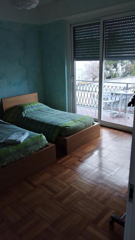 En eller flere senge i et værelse på VillAlbero B&B