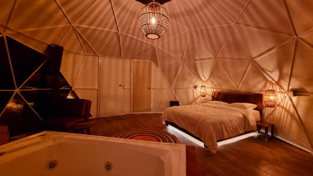 Postel nebo postele na pokoji v ubytování Glamping-Zingo