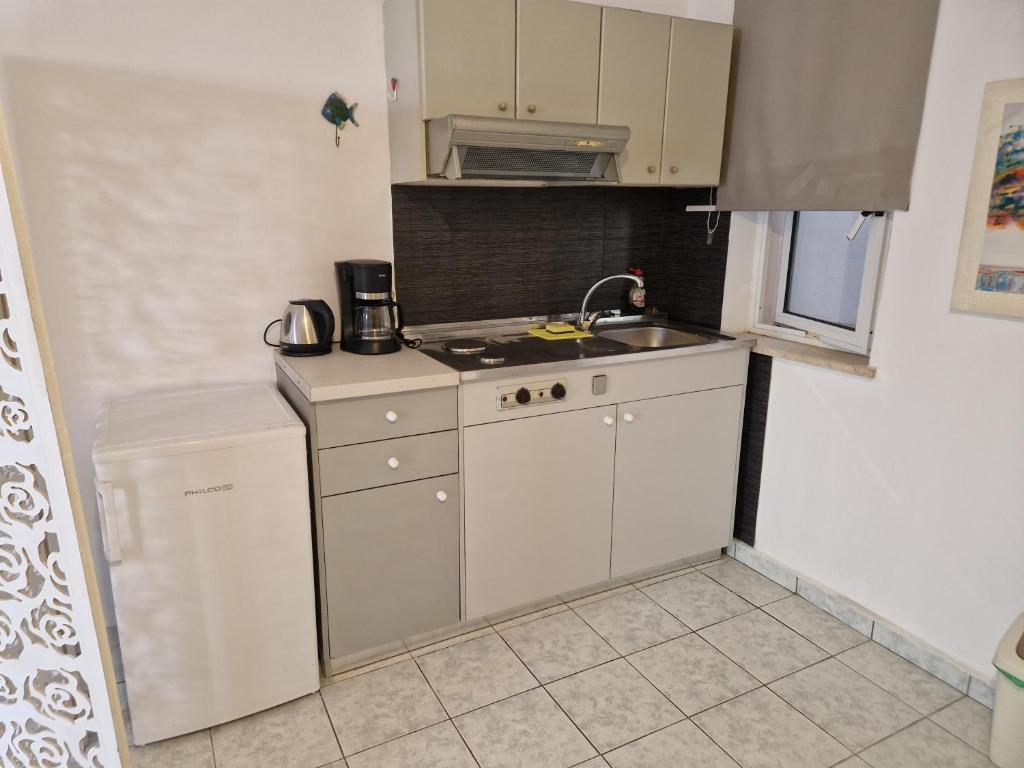 A kitchen or kitchenette at Halepa Apartments