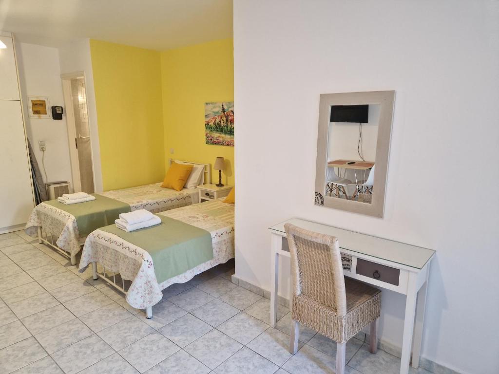 A bed or beds in a room at Halepa Apartments