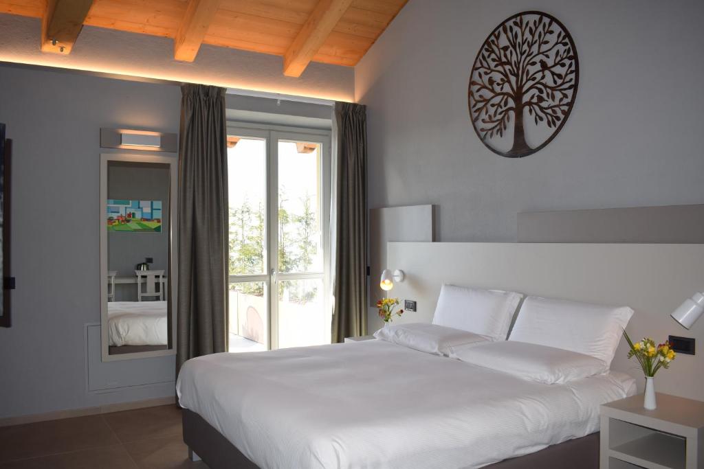 Postel nebo postele na pokoji v ubytování Agriturismo Le Arcate