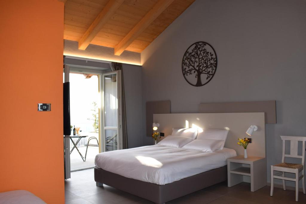 Postel nebo postele na pokoji v ubytování Agriturismo Le Arcate