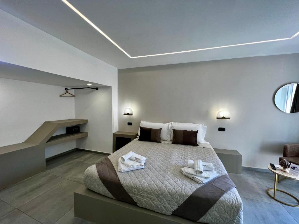 A bed or beds in a room at Palermo Inn Boutique Arte