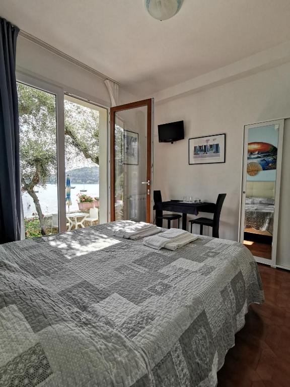 Postel nebo postele na pokoji v ubytování B&B La Palafitta