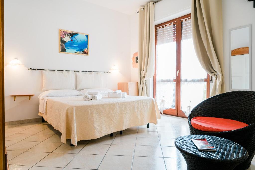 A bed or beds in a room at La Marmora