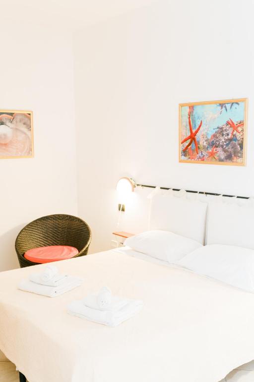 A bed or beds in a room at La Marmora