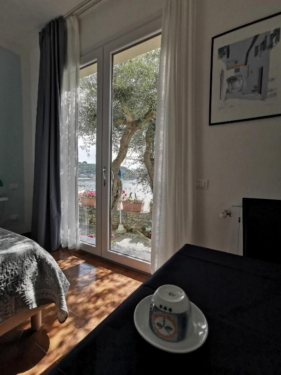 Postel nebo postele na pokoji v ubytování B&B La Palafitta