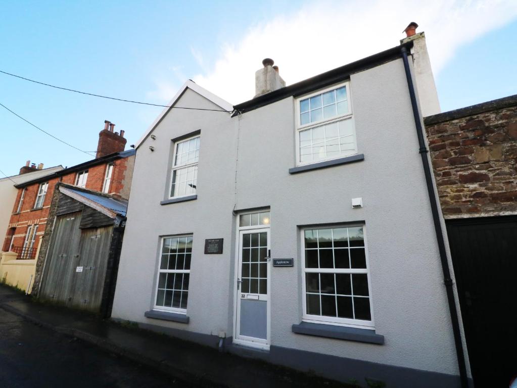 a white house with white doors and windows at Applestow in Bideford