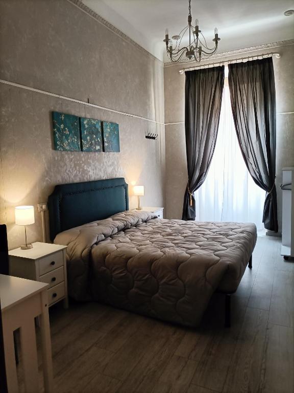 Postel nebo postele na pokoji v ubytování Rossi Hotel