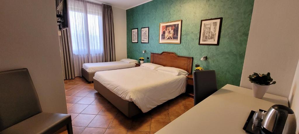 Postel nebo postele na pokoji v ubytování Agriturismo Le Arcate