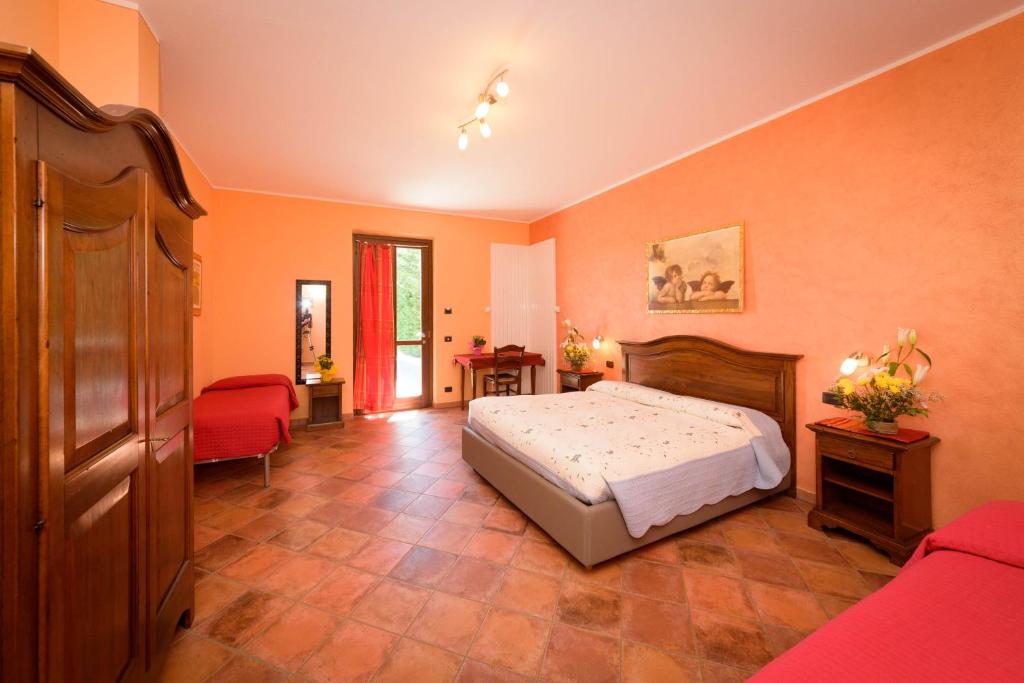 Postel nebo postele na pokoji v ubytování Agriturismo Le Arcate