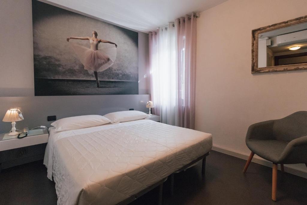 Postel nebo postele na pokoji v ubytování Hotel Gattopardo