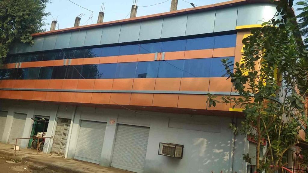 a building with a painting on the side of it at Shivdoot hotal in Bhind