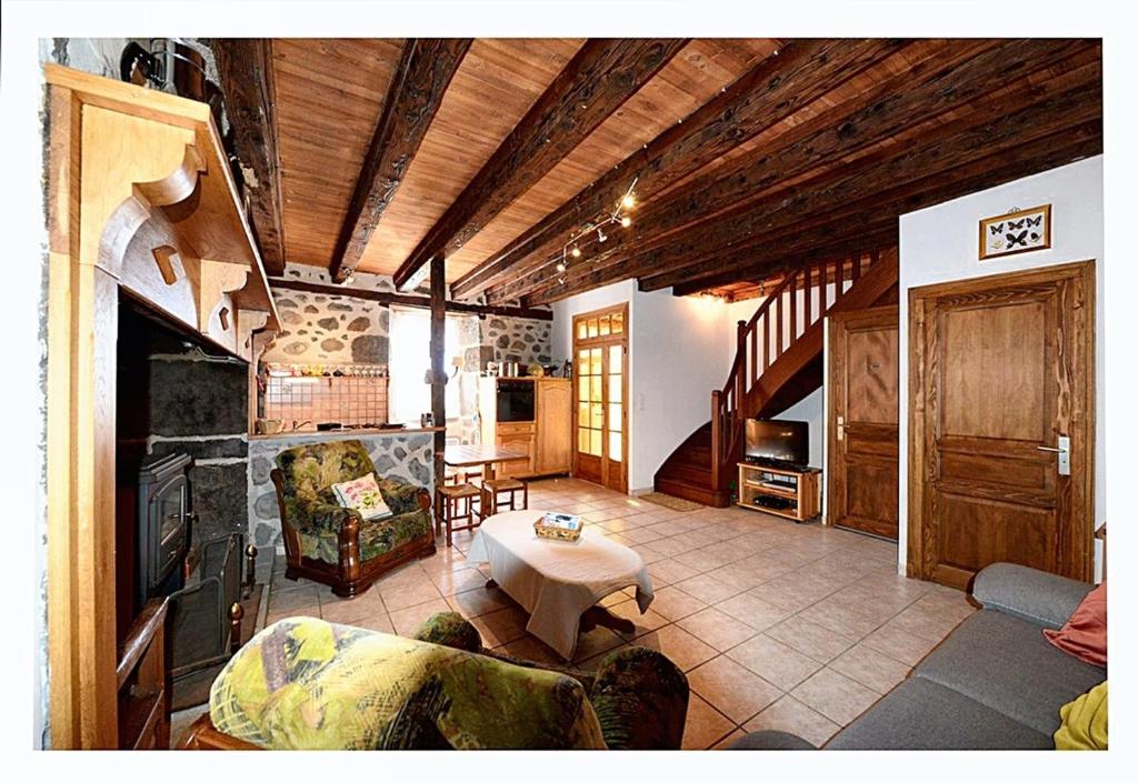 a living room with a couch and a table at Maison de 2 chambres avec jardin clos a Le Fau 