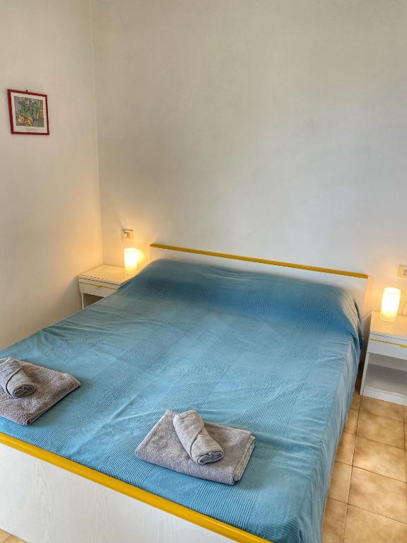 Posteľ alebo postele v izbe v ubytovaní Grazioso Appartamento n 47 a 100mt dal mare
