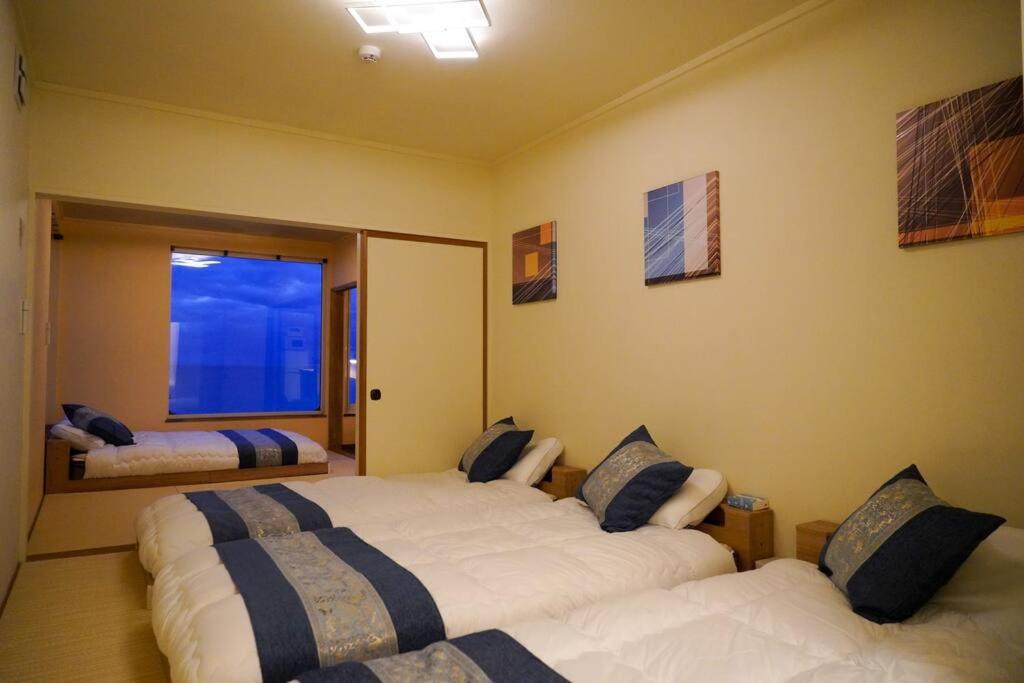 Postel nebo postele na pokoji v ubytování Nesaki Native