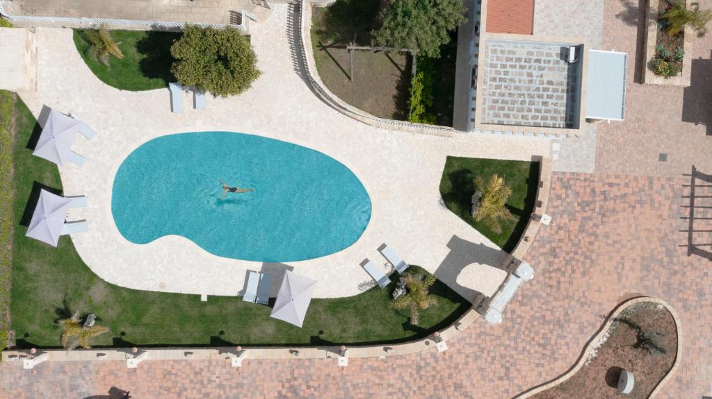 Bazén v ubytování Borgo Specchia Natural Resort nebo v jeho okolí