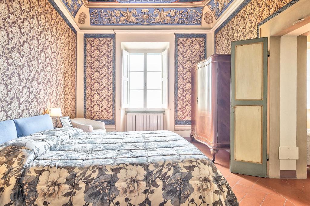Tempat tidur dalam kamar di Il Dipinto - Together in Tuscany