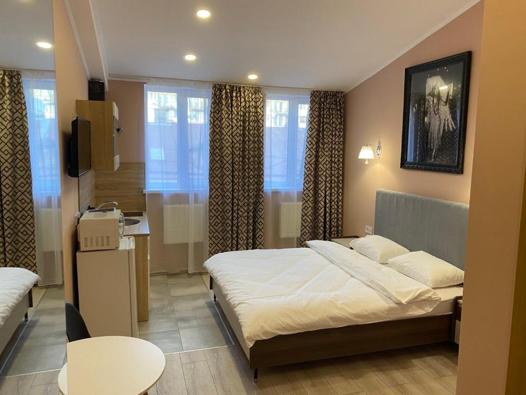 Postel nebo postele na pokoji v ubytování Kyiv Central Apart Hotel
