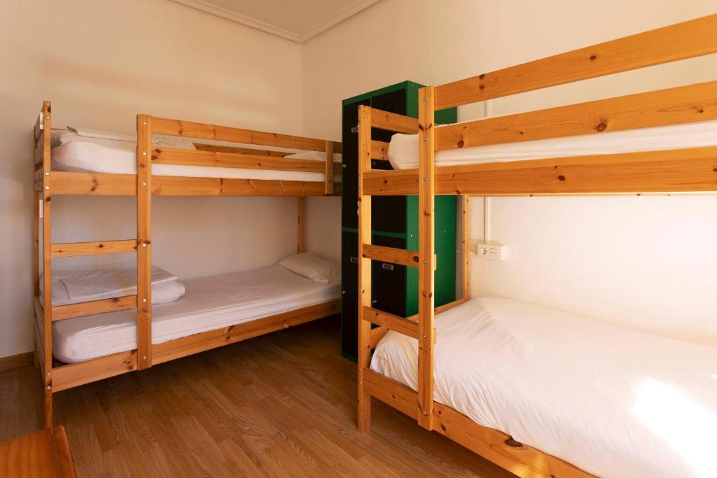 Postel nebo postele na pokoji v ubytování Green Hostel Oviedo
