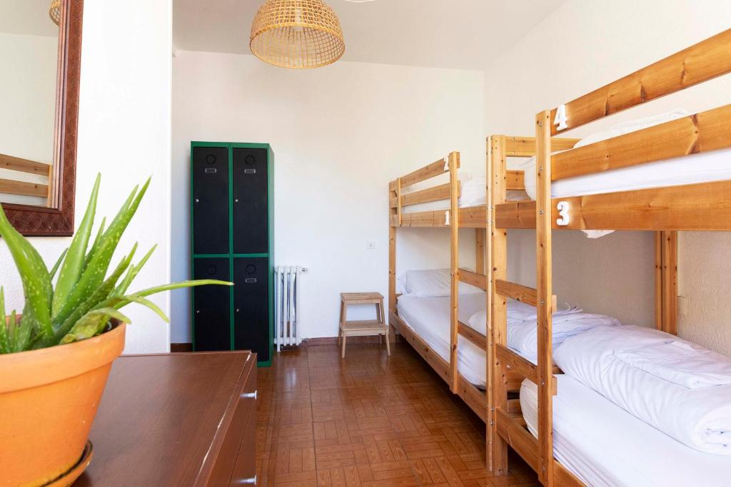 Postel nebo postele na pokoji v ubytování Green Hostel Oviedo