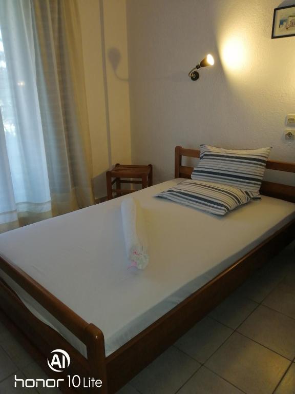 a bed in a room with at Avra Ηouse in Kriopigi