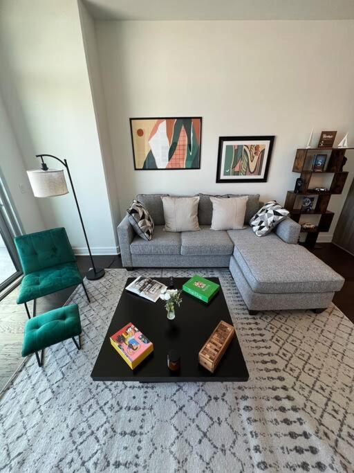 a living room with a couch and a table at Midtown High Rise Escape in Houston