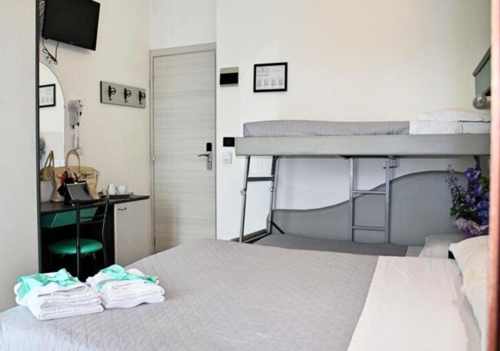 Postel nebo postele na pokoji v ubytování Hotel Tre Stelle