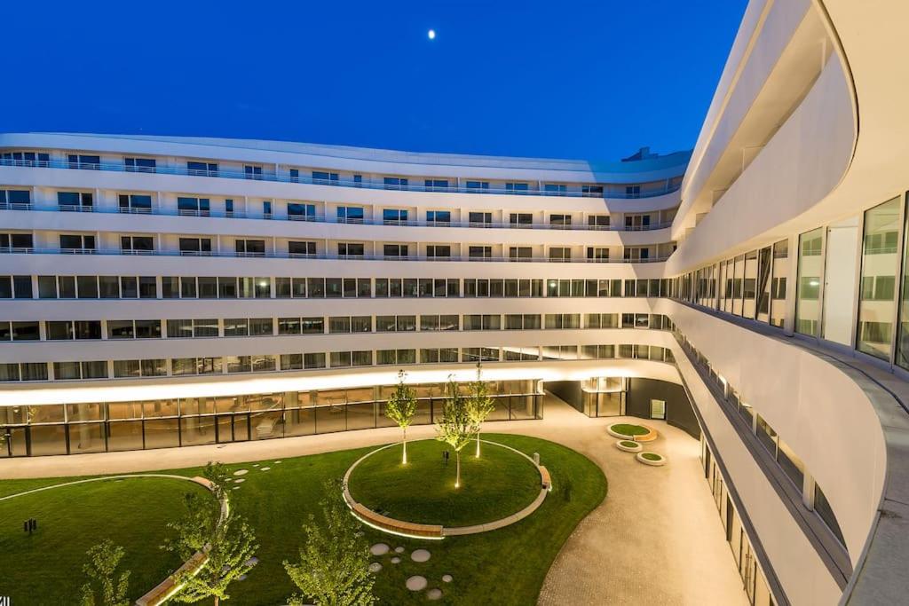 a large building with a courtyard in front of it at ~ Luxury Downtown Haven in Wrocław