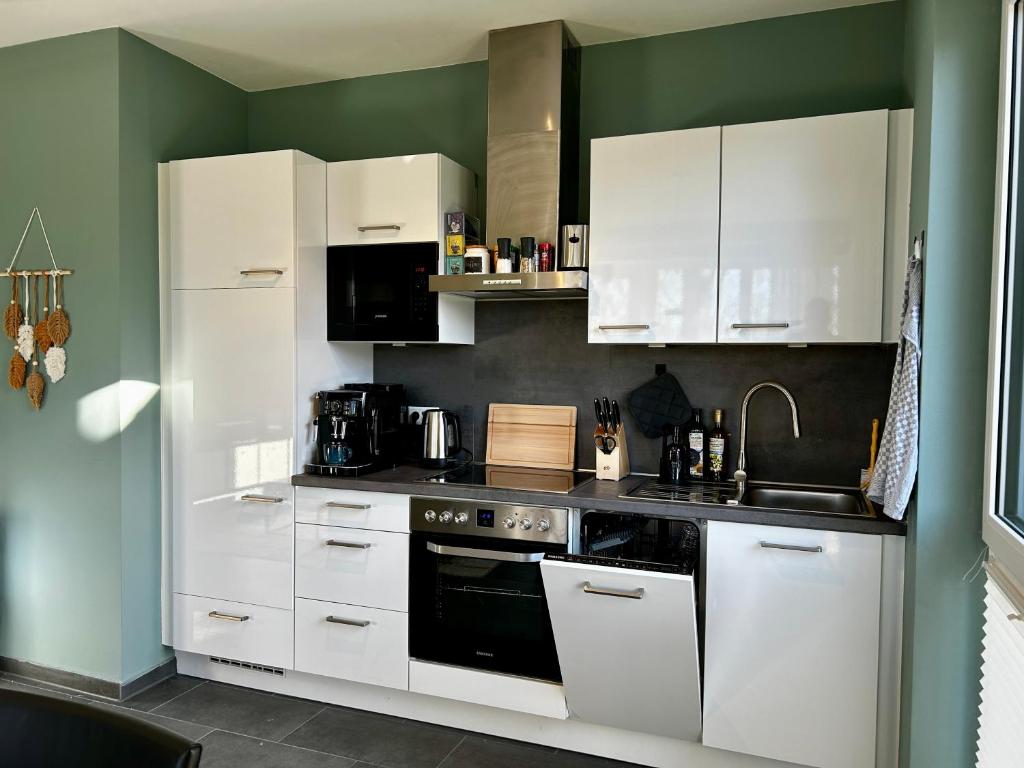 Kuchyň nebo kuchyňský kout v ubytování LITELIVING Cozy Suite